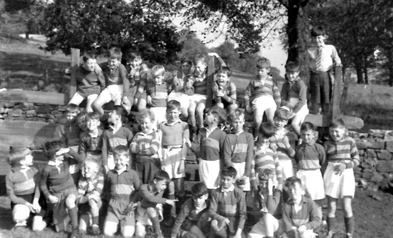 Class Photo 8a.jpg - Class photo taken before a PE Class up in the back field in 1961/62. Back row:- Irish bloke?, ?, Maurice Dougan, Stephen Turnbull, ?, Mike McEwan, Michael Peterson, Gordan Flavel, ?, Brian Potter. Middle Row:- ?,?, Barry Smith, ?, Nicky Brotchie, Charlie ross, ?, Andrew Edie, Adrain L'Estrange, ?, ?, Gerald Stone. Front Row:- ?, ?, Jonathan ?, Tony Heatherington, Ricky Czarnota, Paul Mullhern, Roman Miedzybrodzki, Charlie Kerr, Desmond Deignan. Can you put names to any of the question marks?